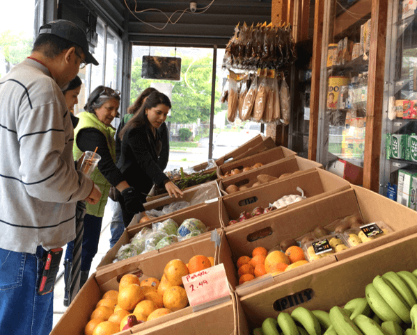 people shopping for produce