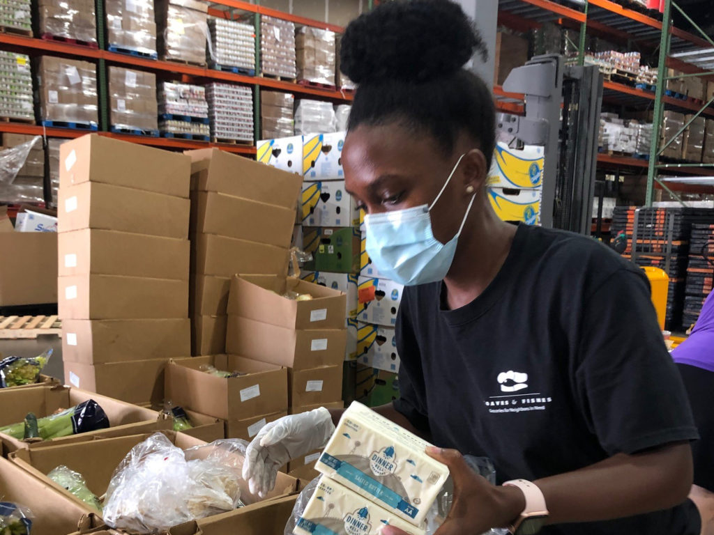 volunteer packing food