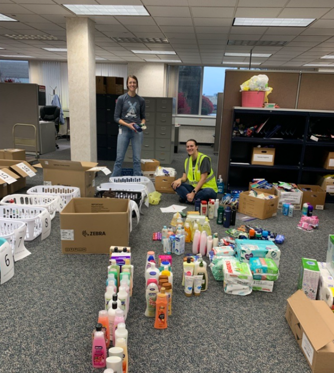 Two Napoleon employees work to sort and organize donated items