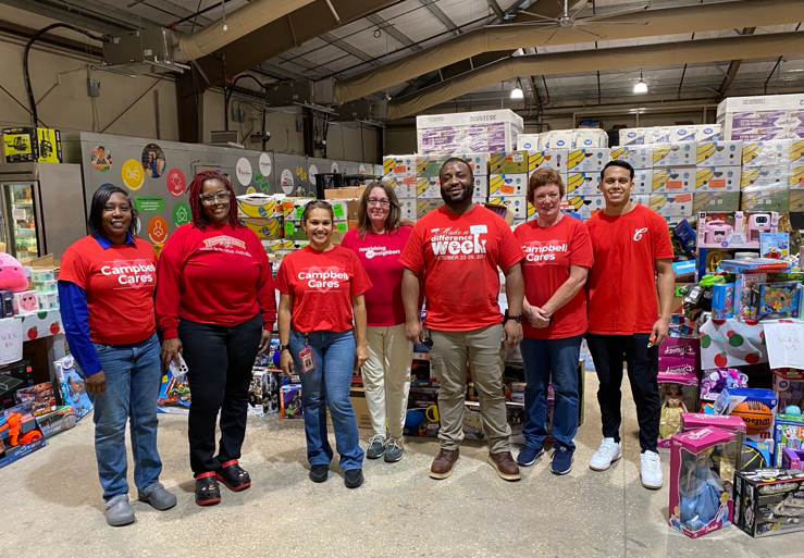 Lakeland team members sorting toys with One More Child as part of the giving campaign